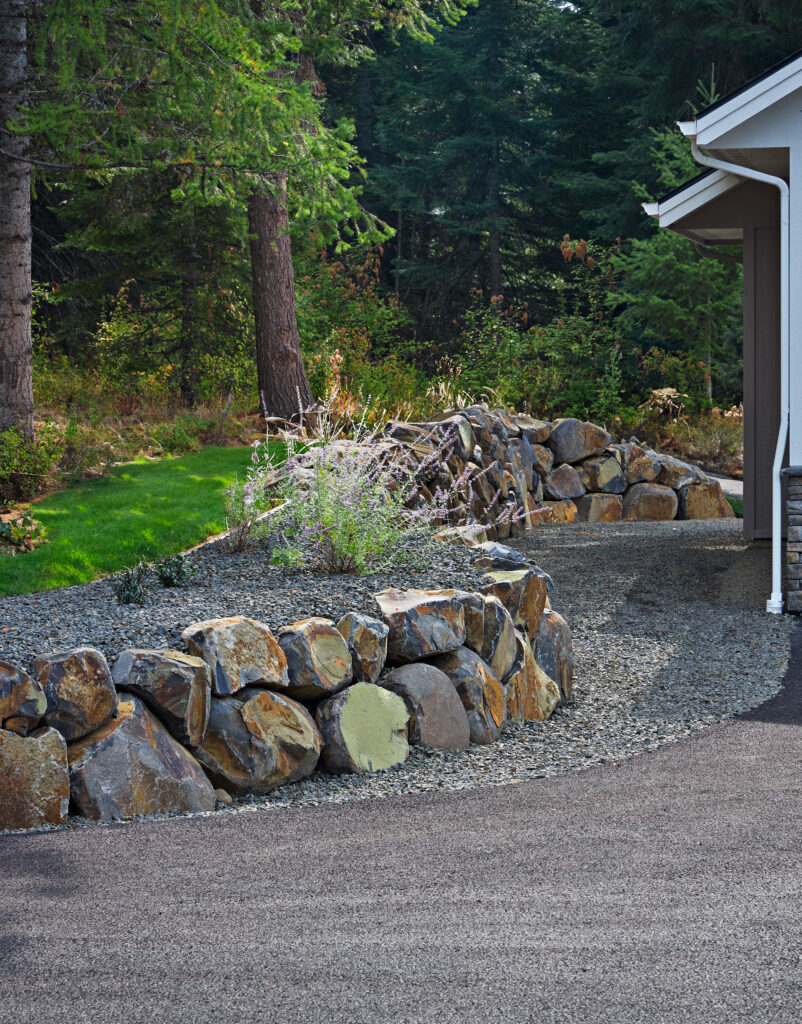 It’s 5 O’Clock In Cougar Bay — Ebbert front rock wall vertical with grass m