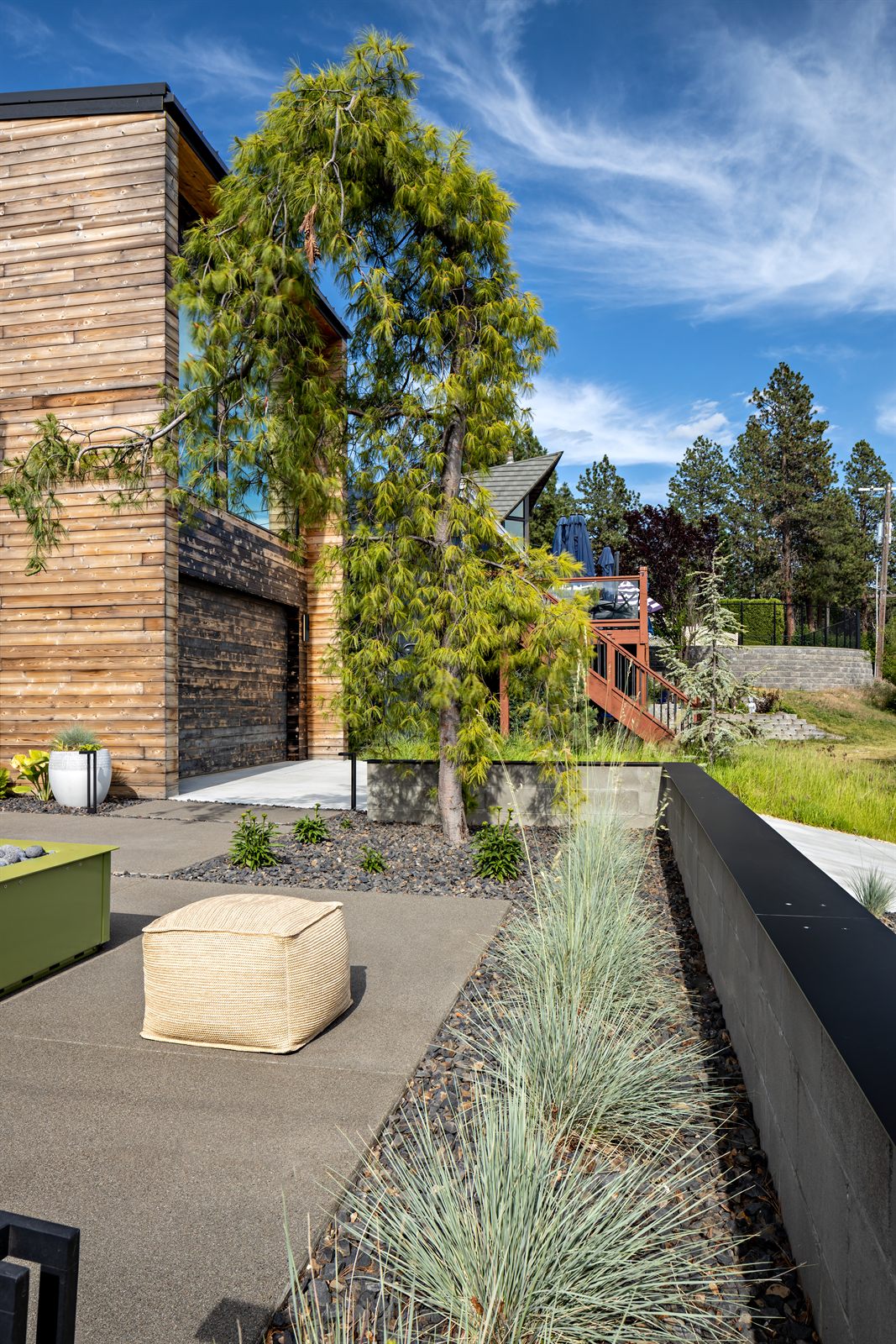 Ornamental grasses and basalt along the back terrace